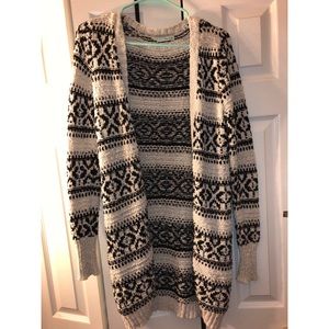 Maurice’s thick cardigan